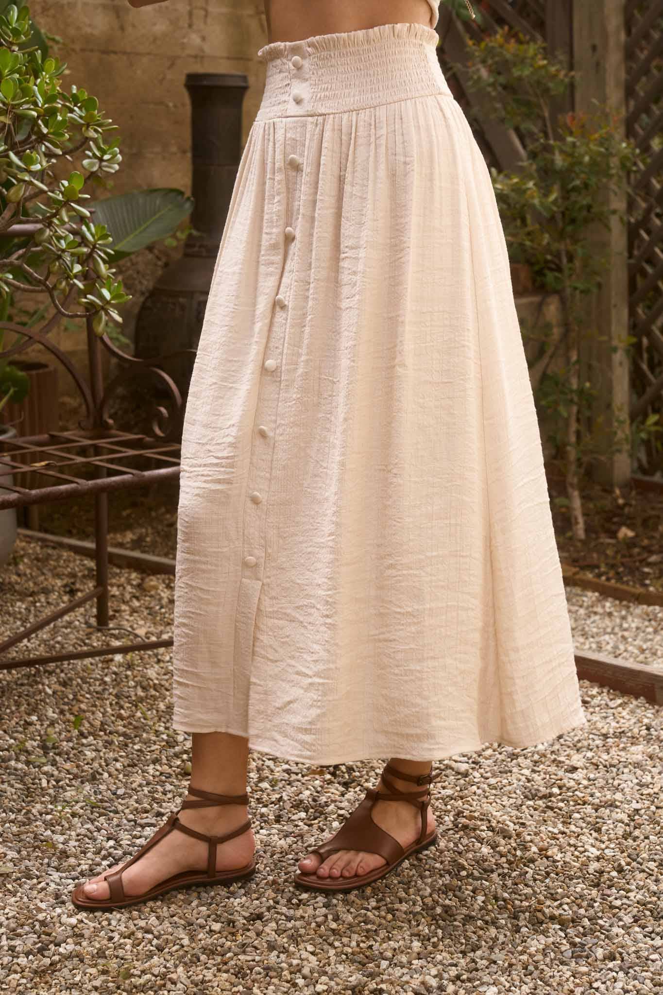 SMOCKED WAIST RUFFLE DETAIL BUTTON DOWN MIDI SKIRT: NATURAL
